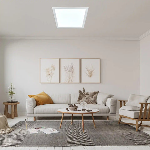 Modern living room with a white sofa, coffee table, decorative elements and square solar light.