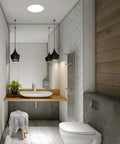 Modern bathroom with wooden vanity, white sink, toilet and solar light.