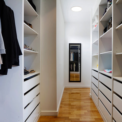 modern walk-in closet with a large round solar light Kit